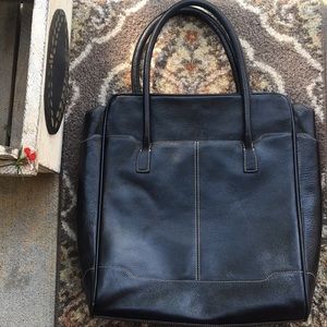 Cole Haan black leather tote bag.